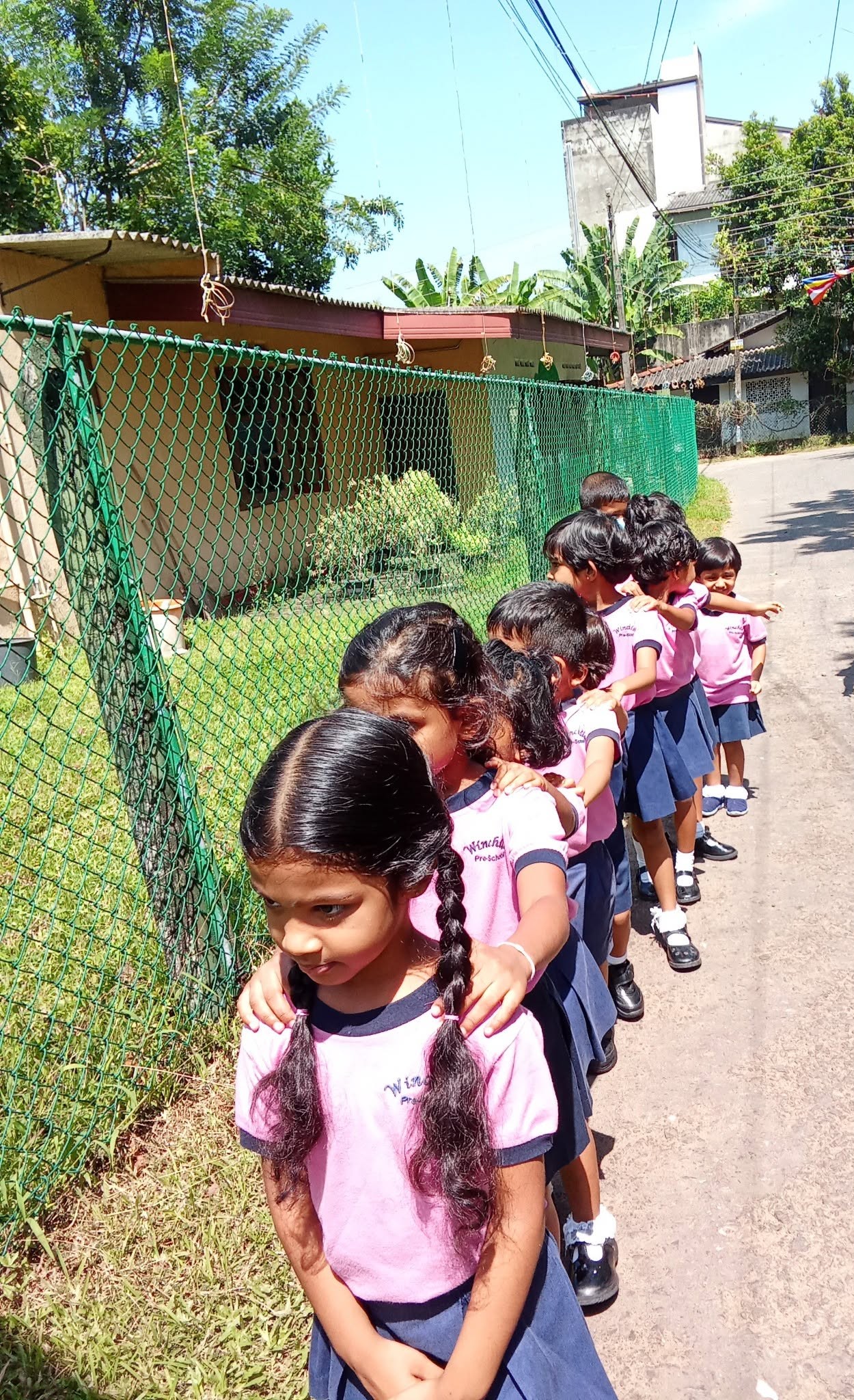 Children lining up during an outdoor walk