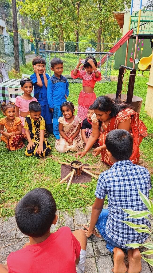 Children learning during an outdoor traditional cooking activity